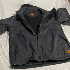 Hugo Boss lined winter coat with removable neck cover.